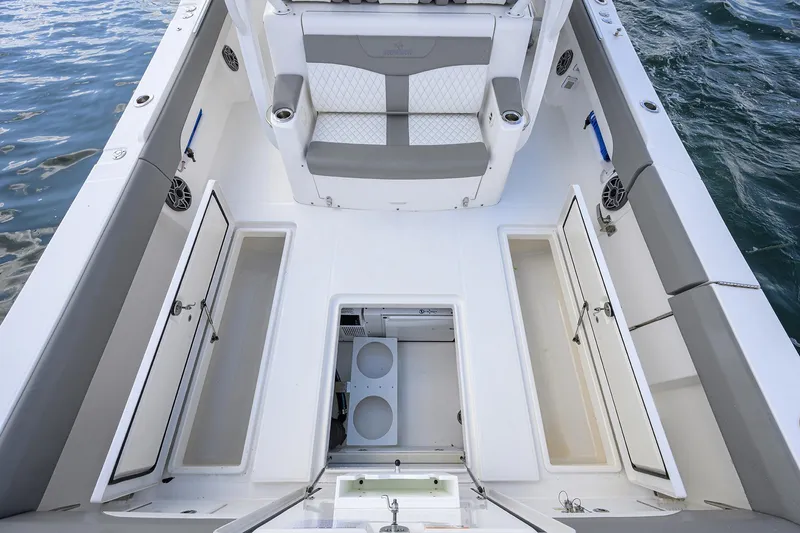  Yacht Photos Pics 2024 Regulator 37 boat interior with open storage compartments and seating.