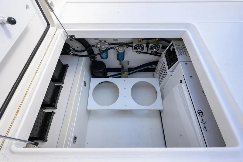  Yacht Photos Pics 2024 Regulator 37 boat storage compartment with organized wiring and equipment.
