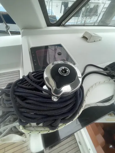 Joie De Vivre Yacht Photos Pics Winch and ropes on a 2014 Beneteau Oceanis 48 sailboat deck.