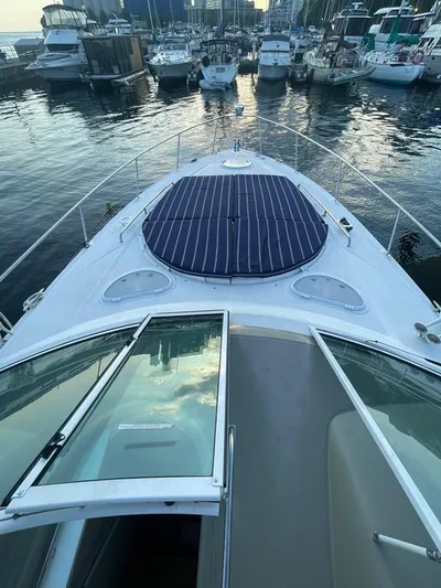  Yacht Photos Pics 2009 Cruisers Yachts 360 Express docked at marina, view from bow.