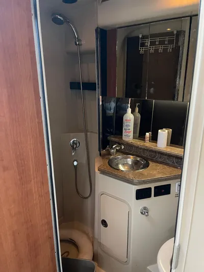  Yacht Photos Pics 2009 Cruisers Yachts 360 Express bathroom with shower, sink, and mirror.