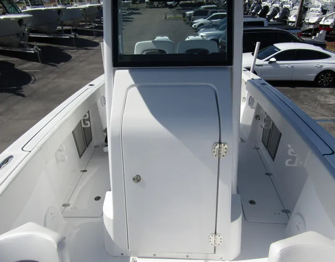 Yacht Photos Pics 2024 Wellcraft 263 Fisherman boat interior, featuring a center console and spacious deck.