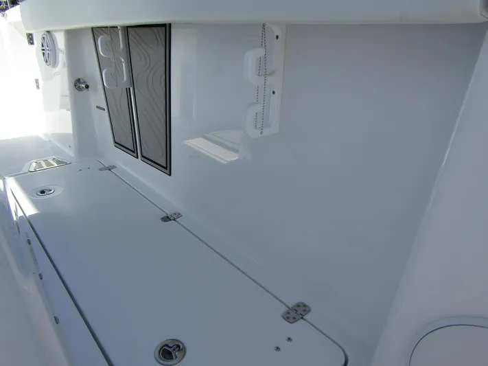  Yacht Photos Pics 2024 Wellcraft 263 Fisherman boat interior storage compartments and speaker system.
