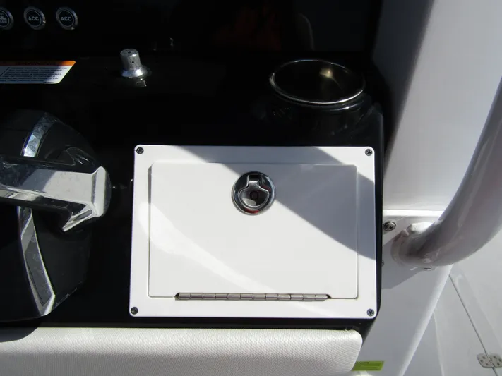  Yacht Photos Pics 2024 Wellcraft 263 Fisherman console with control lever and storage compartment.