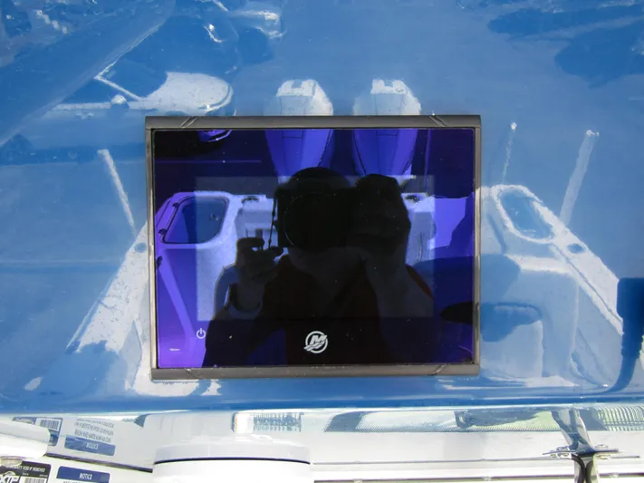  Yacht Photos Pics 2024 Wellcraft 263 Fisherman boat dashboard with reflective display screen.