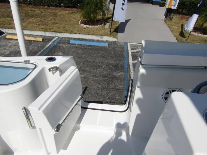  Yacht Photos Pics 2024 Wellcraft 263 Fisherman boat deck with open door and parking lot view.