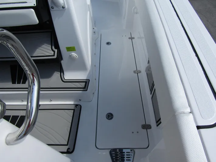  Yacht Photos Pics 2024 Wellcraft 263 Fisherman boat deck with storage compartments and seating.