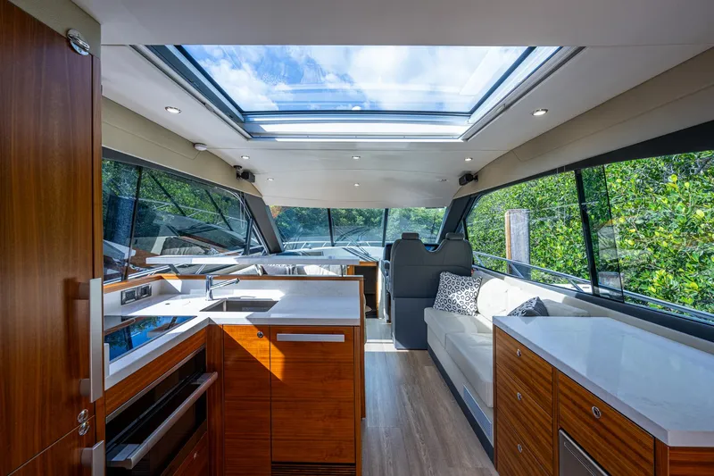 Ciento Siete Yacht Photos Pics Interior of 2020 Maritimo X50 yacht with modern kitchen and seating area.