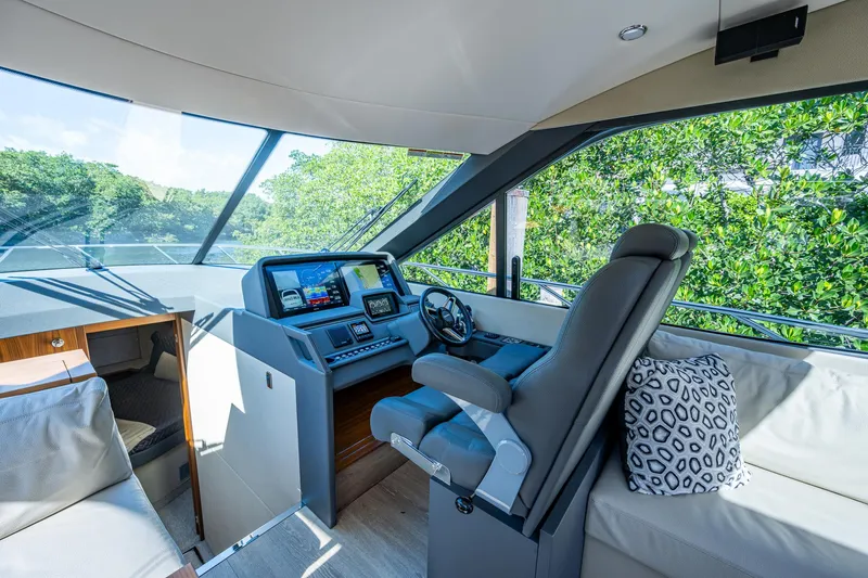 Ciento Siete Yacht Photos Pics 2020 Maritimo X50 yacht helm station with modern navigation displays and luxurious seating.