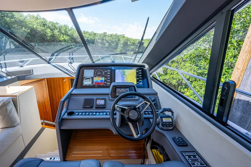 Ciento Siete Yacht Photos Pics 2020 Maritimo X50 yacht helm with advanced navigation system and panoramic windows.