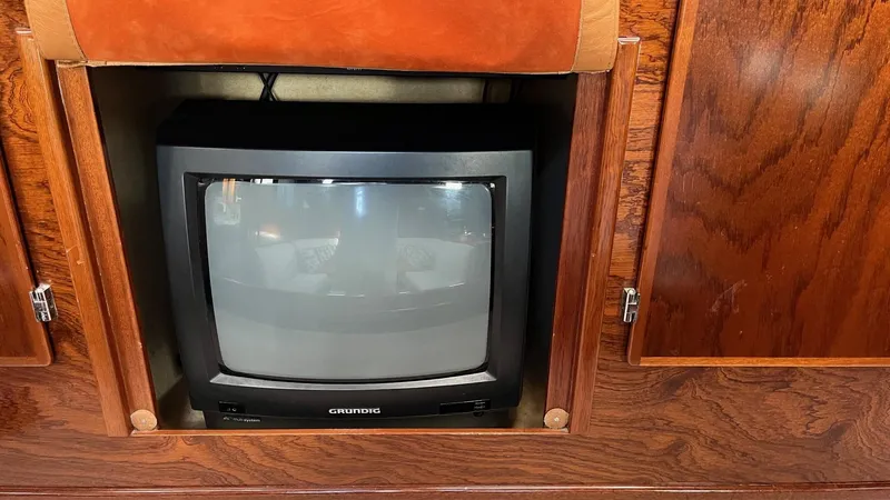 Indigo Yacht Photos Pics Vintage CRT TV in wooden cabinet on 1996 Amel Super Maramu-53 yacht.