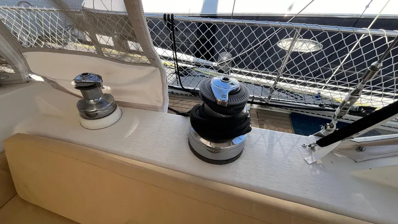 Indigo Yacht Photos Pics Deck view of 1996 Amel Super Maramu-53 sailboat with winches and railing.