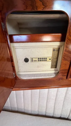 Indigo Yacht Photos Pics Safe inside Amel Super Maramu-53 yacht, 1996 model, with wood paneling.