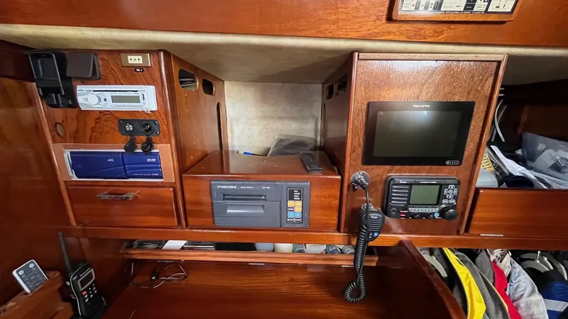 Indigo Yacht Photos Pics Navigation equipment on a 1996 Amel Super Maramu-53 yacht, featuring radio and control panels.