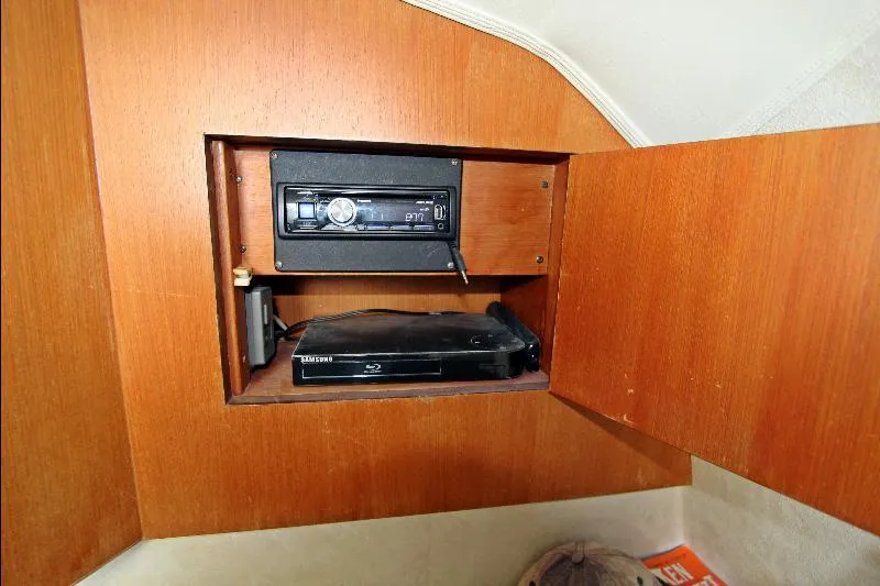  Yacht Photos Pics Built-in stereo and DVD player in Ocean Express Sportfisher 40, 2000 model, wooden cabinet.
