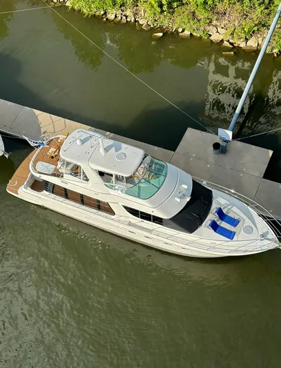 Flying Lady Yacht Photos Pics 2004 Carver 570 Voyager Pilothouse yacht docked in calm waters, aerial view.