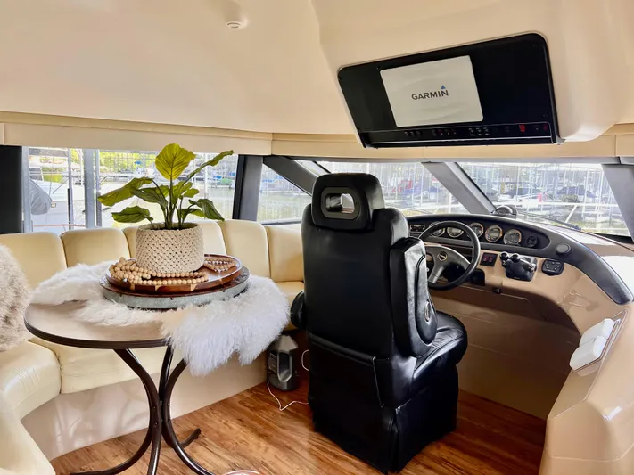 Flying Lady Yacht Photos Pics Luxurious 2004 Carver 570 Voyager Pilothouse interior with plush seating and modern navigation.