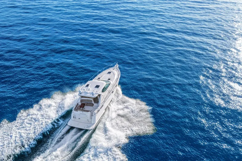  Yacht Photos Pics 2008 Tiara Yachts 4300 Sovran cruising on open blue ocean waters.