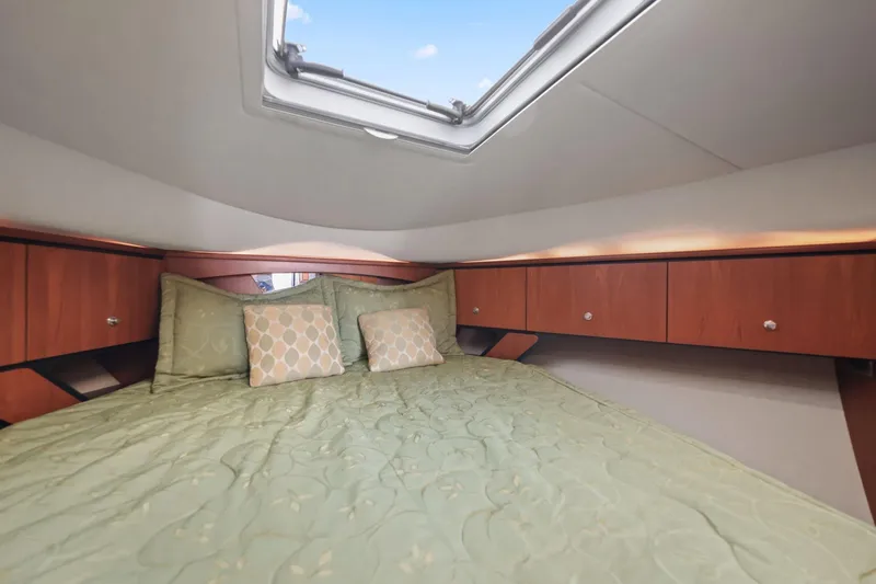  Yacht Photos Pics Luxurious cabin interior of 2008 Tiara Yachts 4300 Sovran with skylight and elegant bedding.