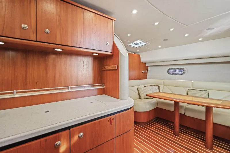  Yacht Photos Pics Luxurious interior of 2008 Tiara Yachts 4300 Sovran with wood cabinetry and plush seating.