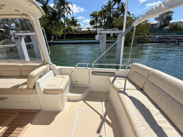 Moncri Yacht Photos Pics Spacious deck of 2012 MJM 36z Downeast yacht with comfortable seating and scenic water view.
