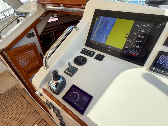 Moncri Yacht Photos Pics Control panel of 2012 MJM 36z Downeast boat with navigation screen and joystick.