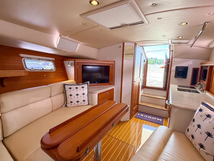 Moncri Yacht Photos Pics Luxurious interior of 2012 MJM 36z Downeast yacht with elegant seating and wooden finishes.