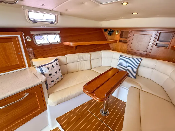 Moncri Yacht Photos Pics Luxurious interior of 2012 MJM 36z Downeast yacht with elegant wood and leather seating.