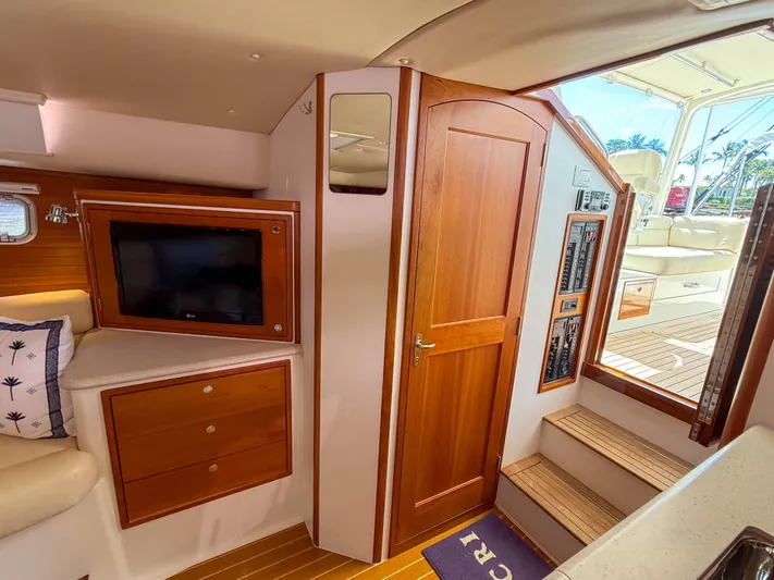 Moncri Yacht Photos Pics Interior of 2012 MJM 36z Downeast yacht with wood paneling and modern amenities.