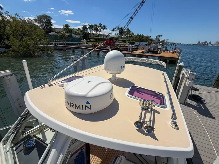 Moncri Yacht Photos Pics 2012 MJM 36z Downeast boat docked, featuring Garmin and Intellian equipment on deck.