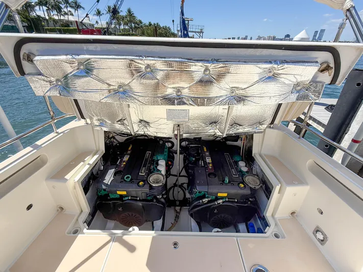 Moncri Yacht Photos Pics Engine compartment of 2012 MJM 36z Downeast boat, showcasing dual engines and insulation.