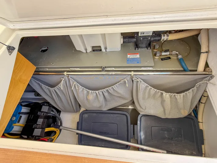 Moncri Yacht Photos Pics Storage compartment of 2012 MJM 36z Downeast boat with equipment and containers.