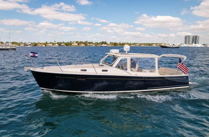 Moncri Yacht Photos Pics 2012 MJM 36z Downeast boat cruising on a sunny day with clear skies.