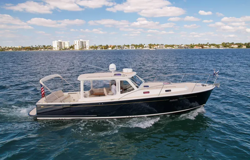 Moncri Yacht Photos Pics 2012 MJM 36z Downeast cruising on open water under a partly cloudy sky.