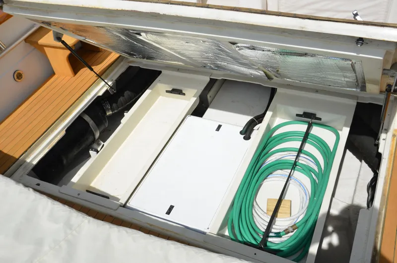 Patriot Yacht Photos Pics Open engine compartment of 2003 Little Harbor WhisperJet 38 with organized hoses and components.