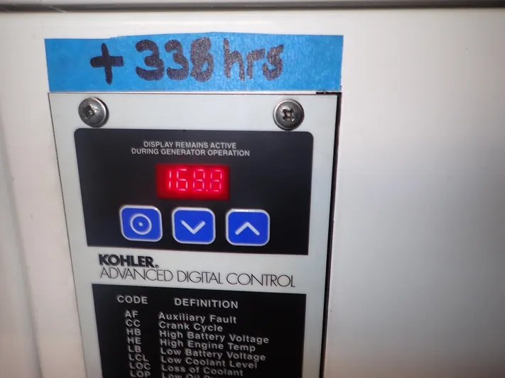 No Quarter Yacht Photos Pics Kohler advanced digital control panel on 2006 Mainship 34 Trawler, showing 1589 hours.