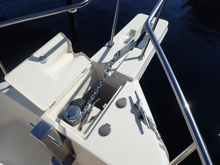 No Quarter Yacht Photos Pics 2006 Mainship 34 Trawler anchor system with chain and winch on deck.