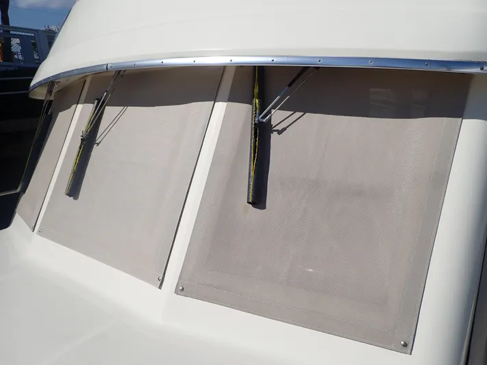 No Quarter Yacht Photos Pics 2006 Mainship 34 Trawler windshield with wipers and sunshades.