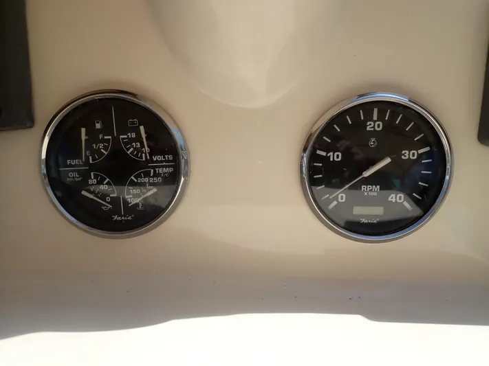 No Quarter Yacht Photos Pics Gauges on 2006 Mainship 34 Trawler dashboard, displaying fuel, volts, temperature, and RPM.