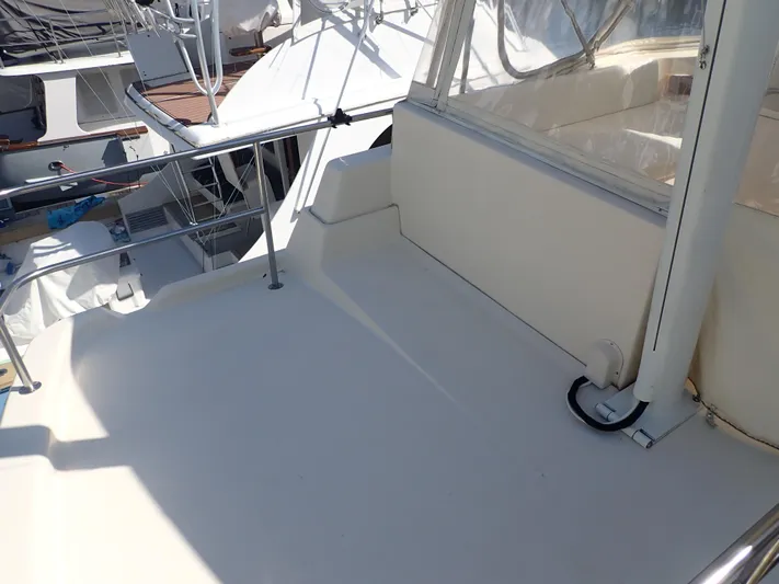 No Quarter Yacht Photos Pics 2006 Mainship 34 Trawler deck area with railing and seating.