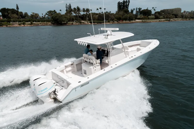  Yacht Photos Pics 2012 Jupiter 34 FS boat cruising on water with twin Yamaha engines.