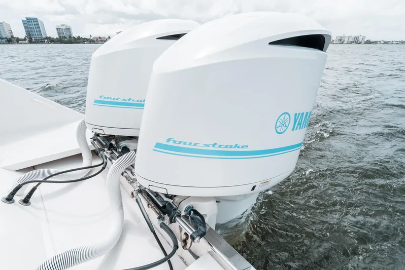  Yacht Photos Pics Twin Yamaha four-stroke outboard engines on a 2012 Jupiter 34 FS boat in water.