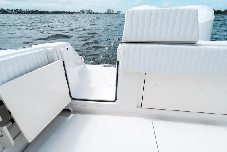  Yacht Photos Pics 2012 Jupiter 34 FS boat interior with white seating, open door, and ocean view.