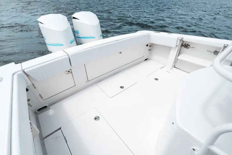  Yacht Photos Pics 2012 Jupiter 34 FS boat deck with twin outboard engines on water.