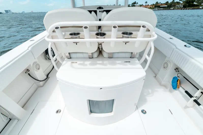  Yacht Photos Pics 2012 Jupiter 34 FS boat interior with rod holders and seating, on calm water.