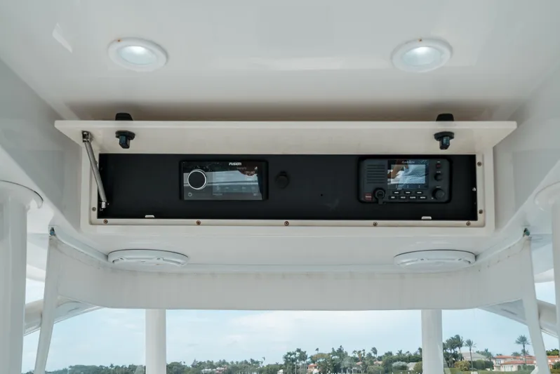  Yacht Photos Pics 2012 Jupiter 34 FS boat electronics panel with Fusion stereo and communication device.