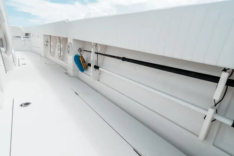  Yacht Photos Pics 2012 Jupiter 34 FS boat deck with storage compartments and cleaning tools.