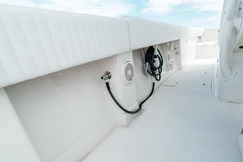  Yacht Photos Pics 2012 Jupiter 34 FS boat interior with white seating and storage compartments.