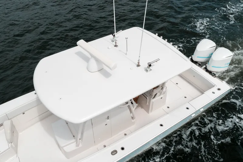  Yacht Photos Pics 2012 Jupiter 34 FS boat with dual outboard engines on open water.