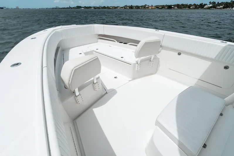  Yacht Photos Pics 2012 Jupiter 34 FS boat interior with white seating, on calm water.